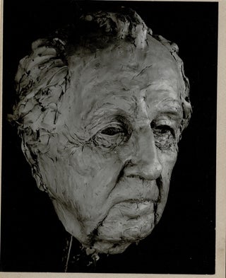 Five mounted photographs of a clay bust of Frank Lloyd Wright